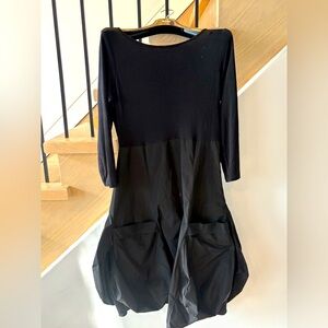 Black dress. Jersey top, parachute bottom. Pockets